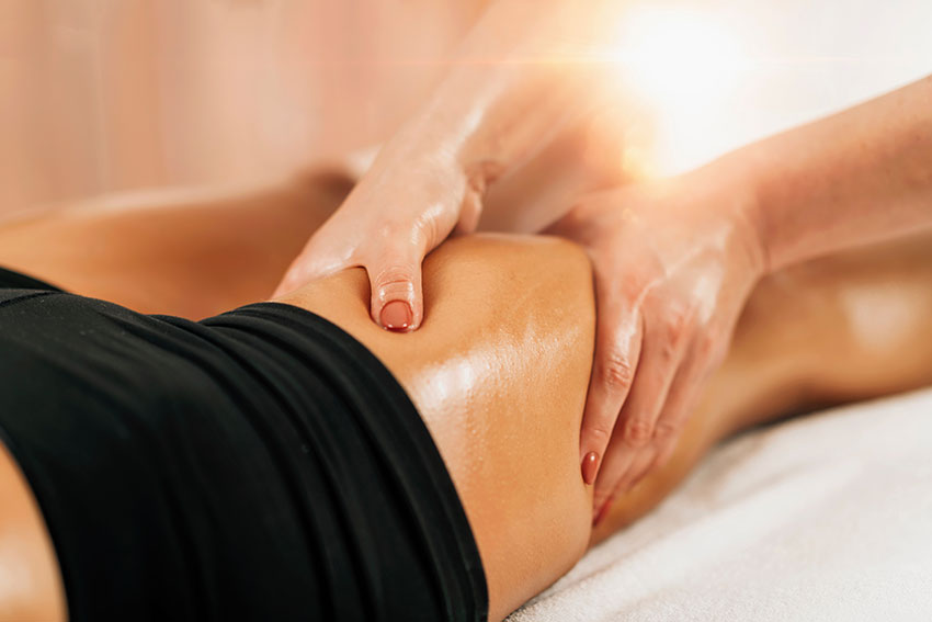 Anti cellulite female thigh massage at a beauty spa salon. Body care concept.